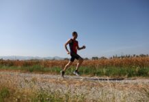 Zone 2 Running for Marathon Training: The Complete Guide Beginner runner jogging in the park during a training session
