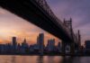 Conquer the New York City Marathon: Coach T’s Race Strategy for the Five Boroughs Runners crossing the Verrazano-Narrows Bridge at sunrise during the New York City Marathon, heading toward Manhattan