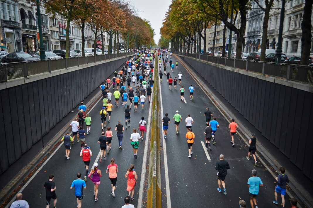 marathon runners pushing toward the finish line during a major race