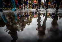 New Year Marathon Mastery: The Beginner Plan That Works Marathon runners in winter, mid-race, focusing on their stride and determination.