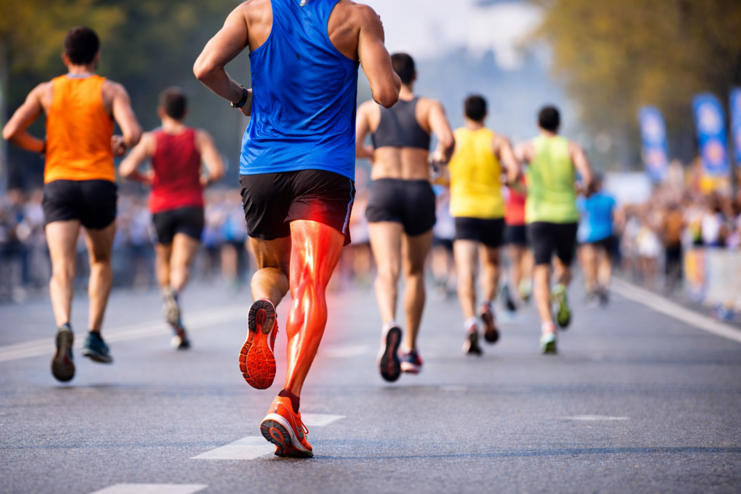 Runner racing marathon with hamstring strain recovery focus