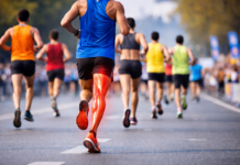 Hamstring Strain in Runners: Pain-Free Recovery Guide Runner racing marathon with hamstring strain recovery focus