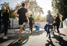 Marathon Coach: What You Actually Get From 1-on-1 Online Coaching Runner training outdoors on a road during a marathon training session